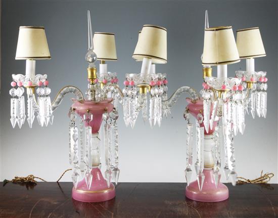 A pair of pink and white gilt decorated glass table lustres, total height 52cm